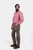 Complete side view of a man wearing lederhosen long paired with red checkered shirt and brown matching shoes