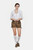 A woman wearing a white blouse with lace-trimmed collar and silver buttons, paired with brown lederhosen shorts featuring embroidered details. She is also wearing white knee-high socks and brown shoes, standing with a relaxed and confident pose.