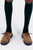 Leory Lederhosen Shoes in tan brown, featuring a robust design with two-tone laces. The shoes are shown paired with green knee-high socks, showcasing their traditional Bavarian style and versatility.