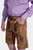 Closed side view of a man in Brecht Classic Lederhosen, Burnished Bronze with intricate embroidery and stylish buttons.