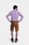 Rear view of a man in Brecht Classic Lederhosen, Burnished Bronze with intricate embroidery and stylish buttons.