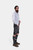 Side profile of the man in Lederhosen, emphasizing the button details and side pocket.