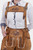 Close-up view of the Diane Kruger Lederhosen with suspenders, showcasing the intricate natural color embroidery on the bib and legs.
