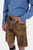  Side profile of the Edelweiss Lederhosen, highlighting the knee-length design and detailed embroidery, with the man’s hand in his pocket.