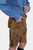 Side profile of the Edelweiss Lederhosen, highlighting the knee-length design and detailed embroidery, with the man’s hand in his pocket.