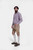 Side profile of man wearing Boris Becker Lederhosen with checkered shirt and knee-high socks.
