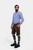 Three-quarter view of a man in Hallstatt Cargo Lederhosen, hands in pockets, paired with knee-high socks and black shoes, showcasing traditional Bavarian fashion.