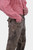 Side view of a person showcasing the details of Wachau Valley Lederhosen Long Pant with embroidered pockets, wearing a red and white checkered shirt.