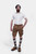 Man wearing Snowbird Cargo Lederhosen with a white dress shirt, standing with hands in pockets including brown and knee-high socks and brown shoes. herren lederhosen kurz, kurze herren lederhose​