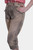 Another side view of the woman in brown leather lederhosen, showcasing the pocket and side embroidery of the pants.