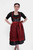 Front view of a woman wearing the Dirndl Kelly, featuring intricate black and red lace detailing with a satin ribbon waistband. schwarzes dirndl
