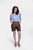 Full body shot of the woman in Elsa Lederhosen, emphasizing the complete outfit from head to toe.  braune lederhose, braune lederhose damen