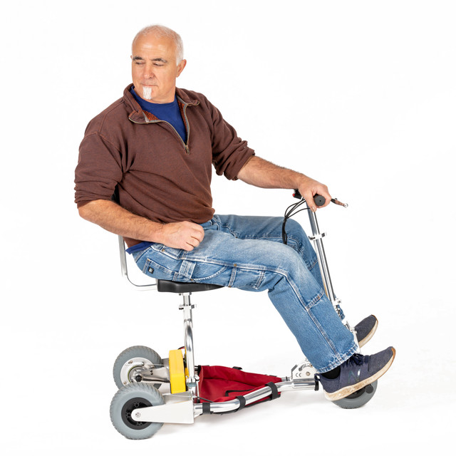 Rider using the TravelScoot Escape reverse function