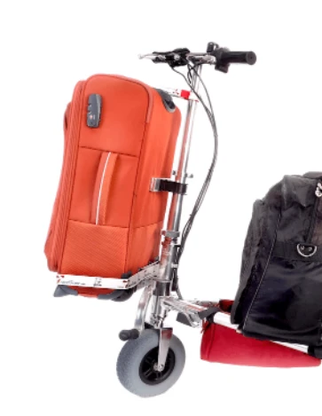 Close-up view of the smart luggage kit on the TravelScoot mobility scooter with a large red carry-on strapped to the front of the scooter.