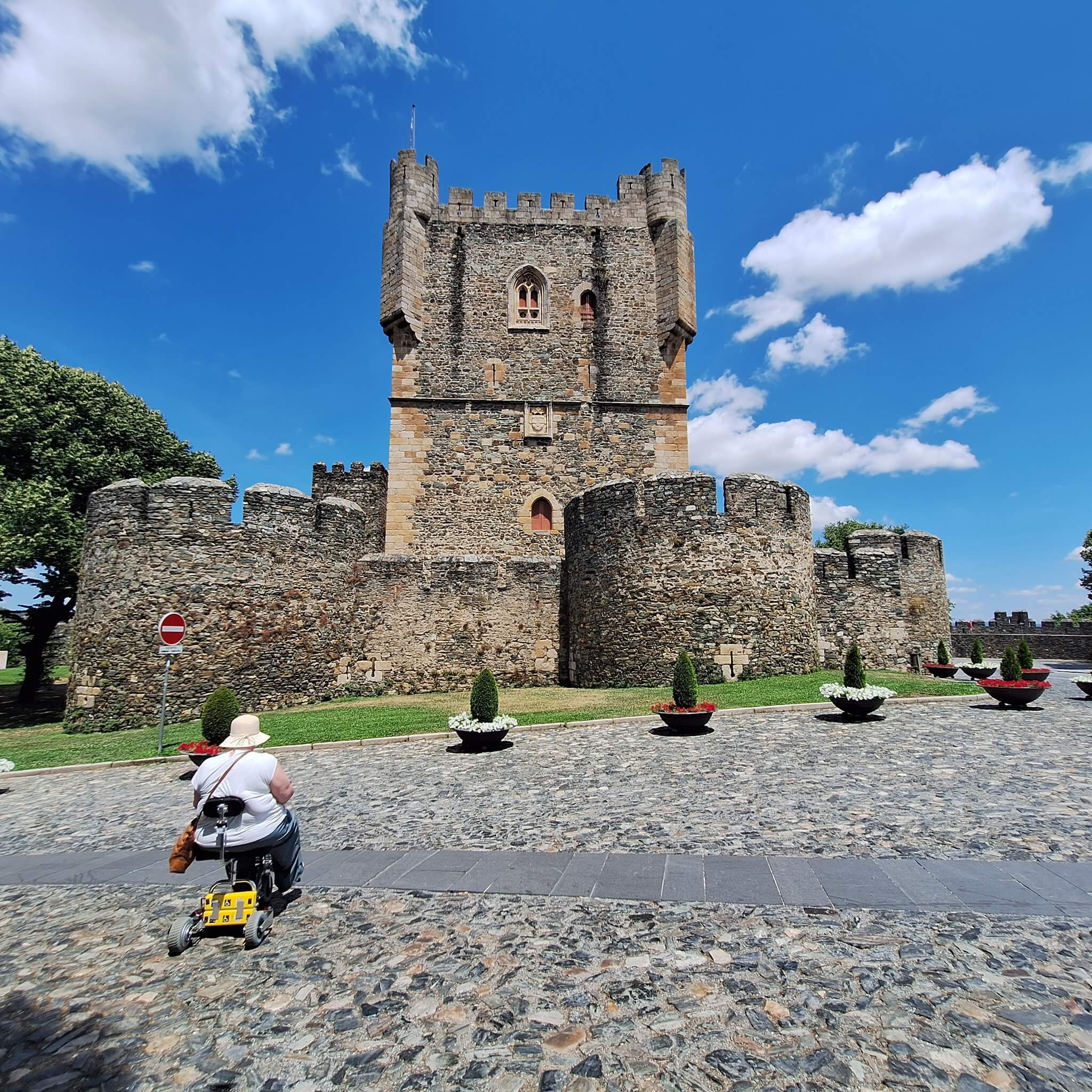 TravelScoot mobility scooter in front of a castle.