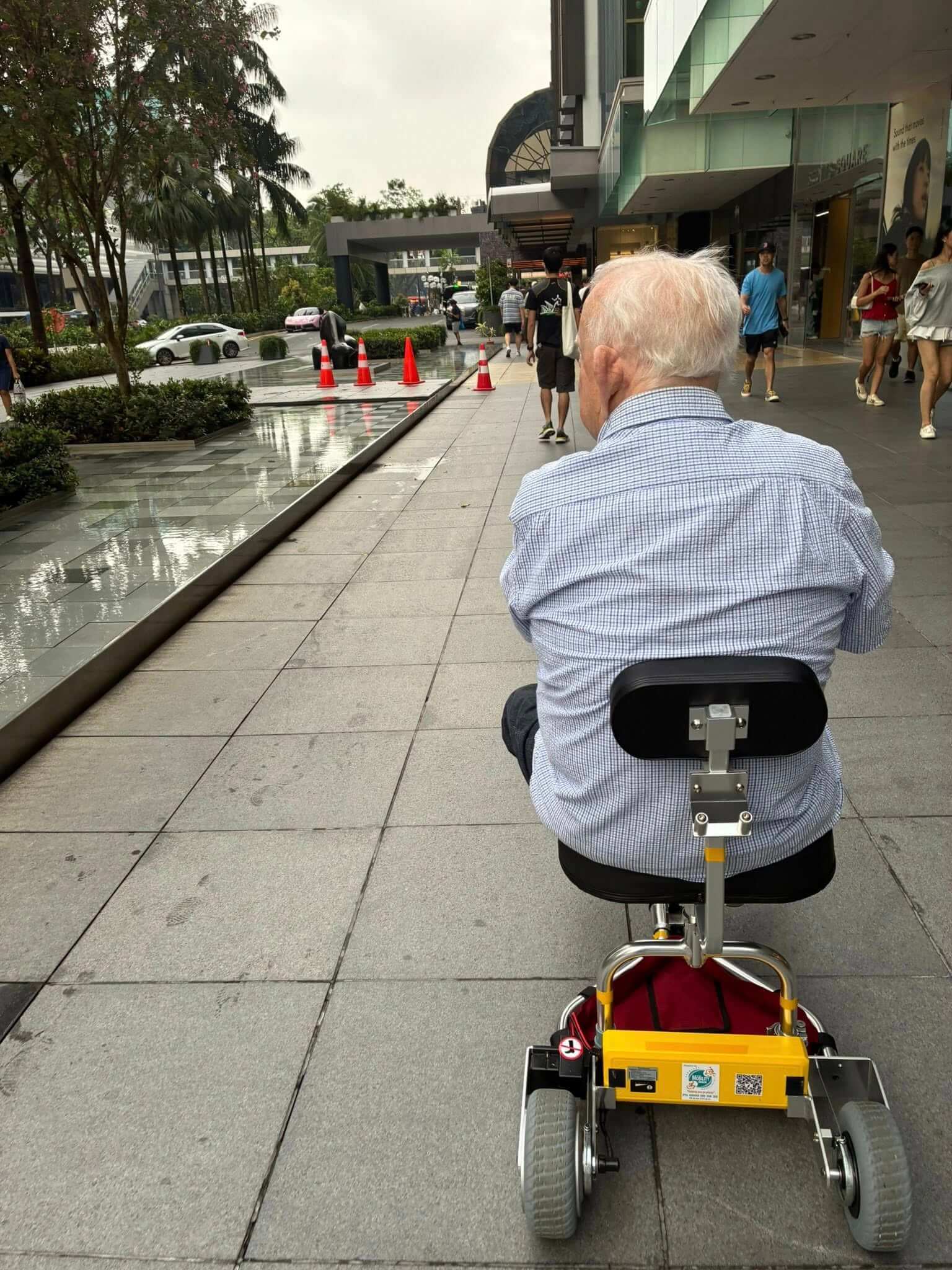 Riding mobility scooter around a foreign city.