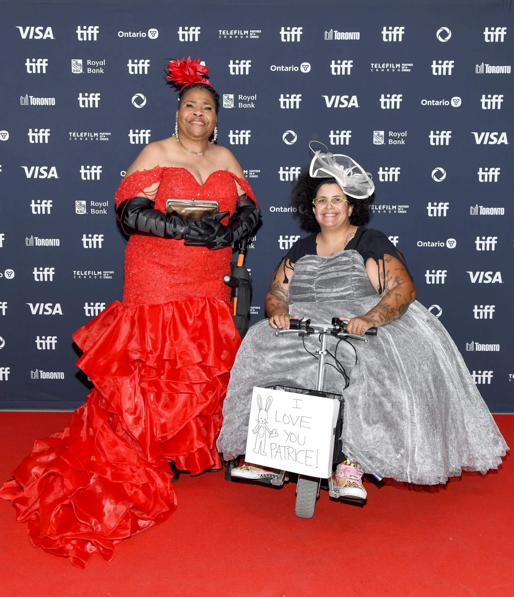 Women at a movie premier on a mobility scooter
