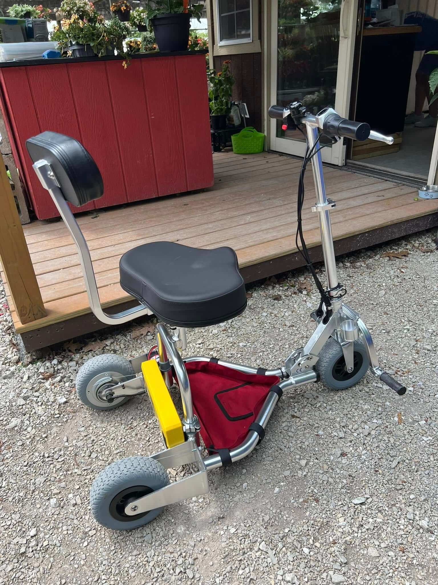 Mobility scooter on gravel path.