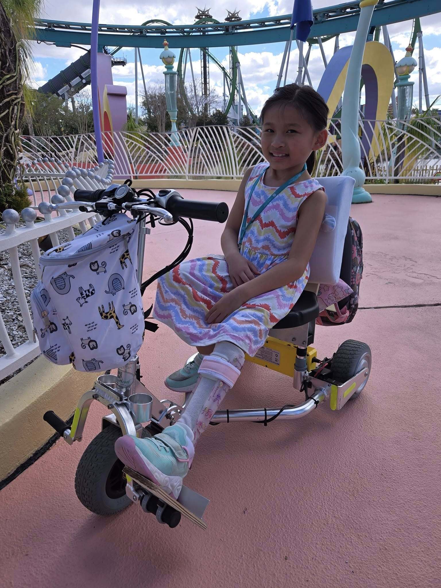Girl on modified scooter smiling