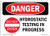 SIGN : CAUTION, HYDROSTATIC TESTING IN PROGRESS SIGN; 400MM X 500MM