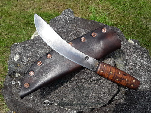 Large hand forged skinning knife with curly maple handle and riveted sheath