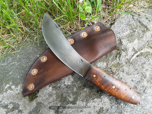 Hand forged skinning knife with curly maple handle and riveted sheath