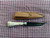 Deer bone handle patch knife with poured pewter bolster right side of knife