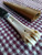 Deer bone handle patch knife with poured pewter bolster closeup of left side of handle