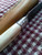 Deer bone handle patch knife with poured pewter bolster closeup of front side of bolster