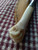 Deer bone handle patch knife with poured pewter bolster closeup of backside of handle