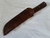 Large hand forged skinning knife with curly maple handle