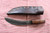 Large hand forged skinning knife with curly maple handle and riveted sheath