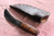 Large hand forged skinning knife with curly maple handle and riveted sheath