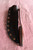 Large hand forged skinning knife with curly maple handle and riveted sheath