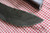 Large hand forged skinning knife with curly maple handle and riveted sheath