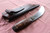 Large hand forged skinning knife with curly maple handle and riveted sheath