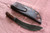 Large hand forged skinning knife with curly maple handle and riveted sheath