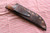 Large hand forged skinning knife with curly maple handle and riveted sheath