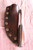 Hand forged skinning knife with curly maple handle and riveted sheath