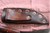 Hand forged skinning knife with curly maple handle and riveted sheath