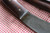 Hand forged skinning knife with curly maple handle and riveted sheath