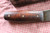 Hand forged skinning knife with curly maple handle and riveted sheath