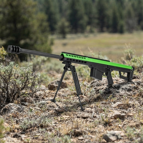 Galaxy G31 M82A1 Bolt Action Airsoft Sniper Rifle in Green & Black resting on a bipod in a rocky outdoor landscape.