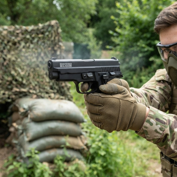 Swiss Arms Navy Compact .40 Gas Blowback Airsoft Pistol in Black held two-handed by a masked player outdoors