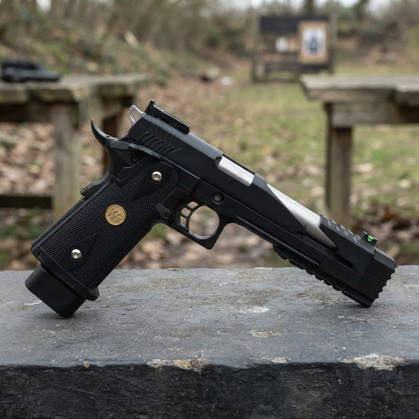 WE Tech Dragon 7.0 Type-B Government model Gas Blowback Airsoft Pistol in Black in side view on an outdoor bench