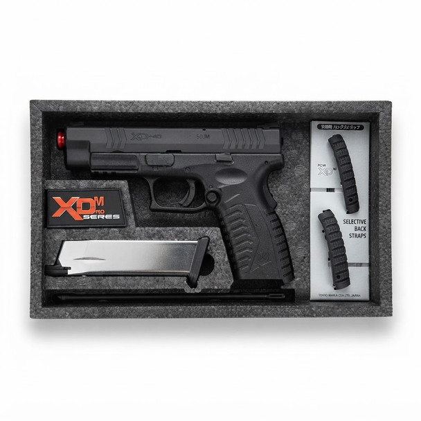 Tokyo Marui XDM-40 GBB Airsoft Pistol inside protective foam packaging with magazine and selective back straps.