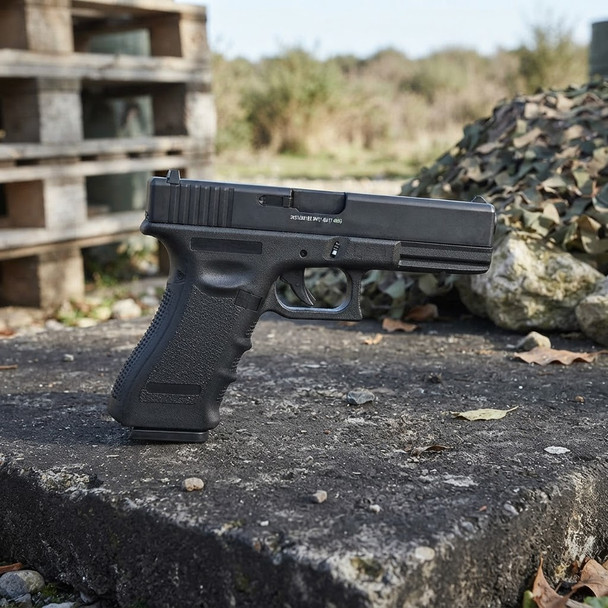 Nuprol Raven EU17 Semi Auto Gas Blowback Airsoft Pistol in Black, side view on an outdoor concrete surface