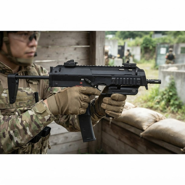 Tokyo Marui MP7A1 Compact AEP Electric Airsoft SMG held in a camouflaged player’s gloved hands at an outdoor range
