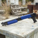 Double Eagle M56B Pump Action Airsoft Shotgun Tri Shot in Blue displayed side-on outdoors