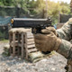 EMG / Salient Arms RED-H Hi-Capa Training Weapon - Gold barrel held by gloved hands outdoors